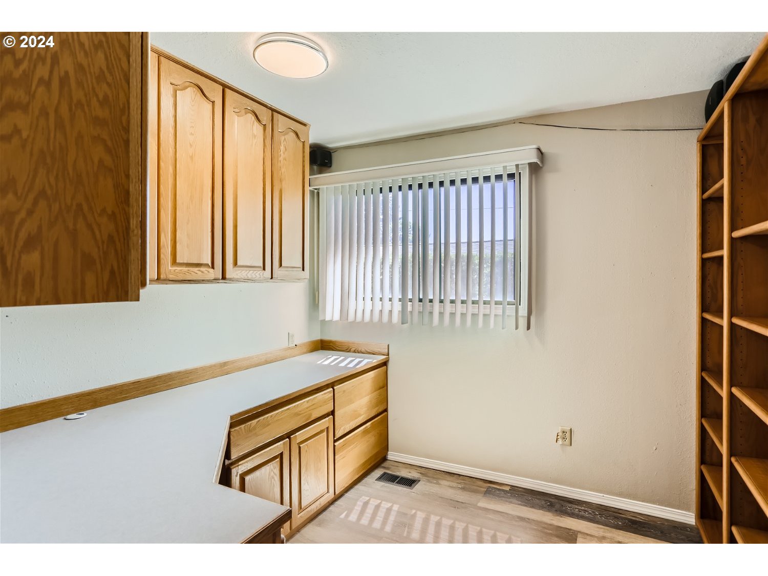 4009 Southeast View Acres Road Milwaukie, OR 97267 - Photo 10 of 37 a view of a room with wooden floor and windows