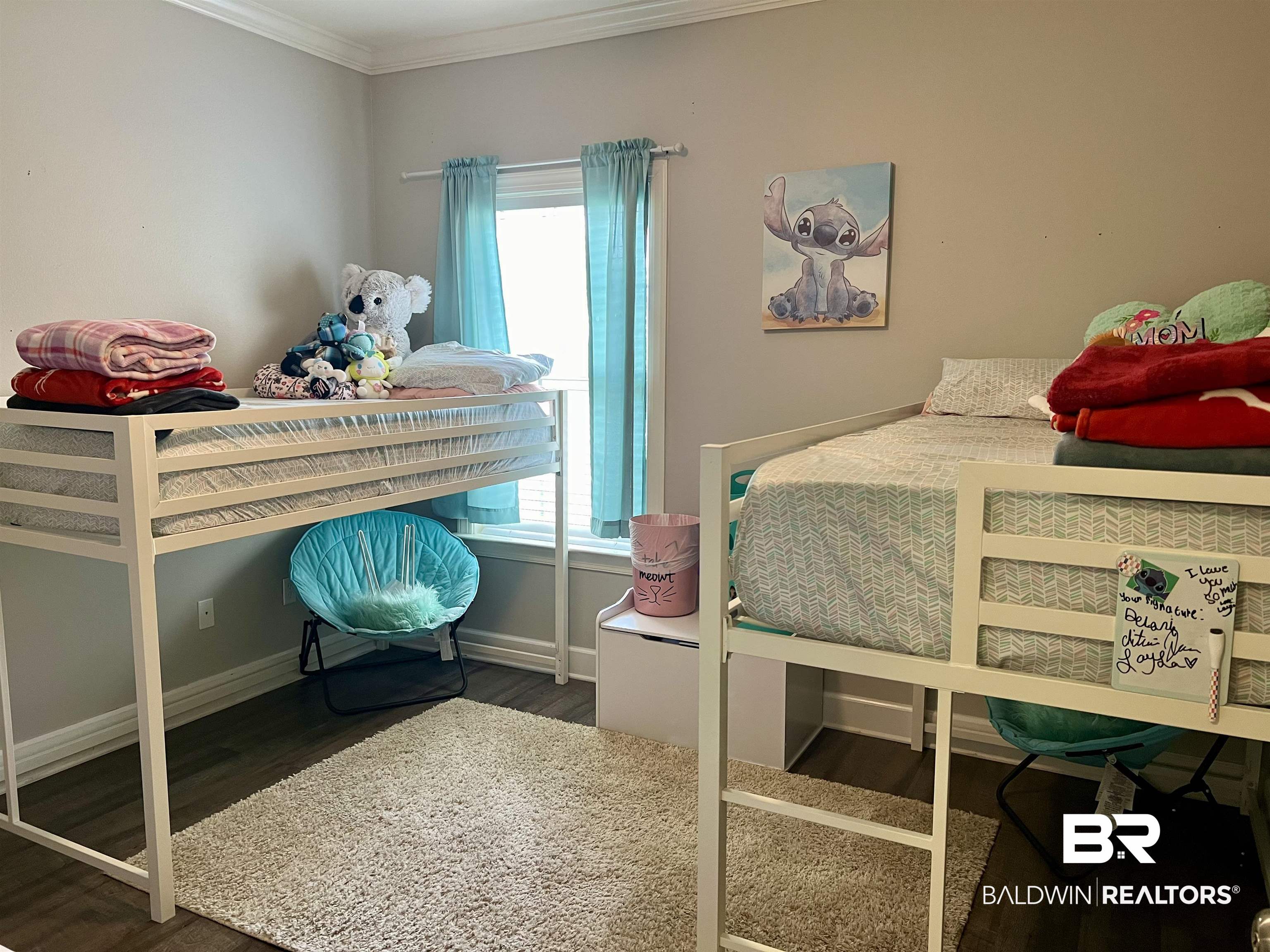 450 Park Avenue, Unit 808 Foley, AL 36535 - Photo 17 of 38 Bedroom featuring multiple windows, crown molding, and dark hardwood / wood-style flooring