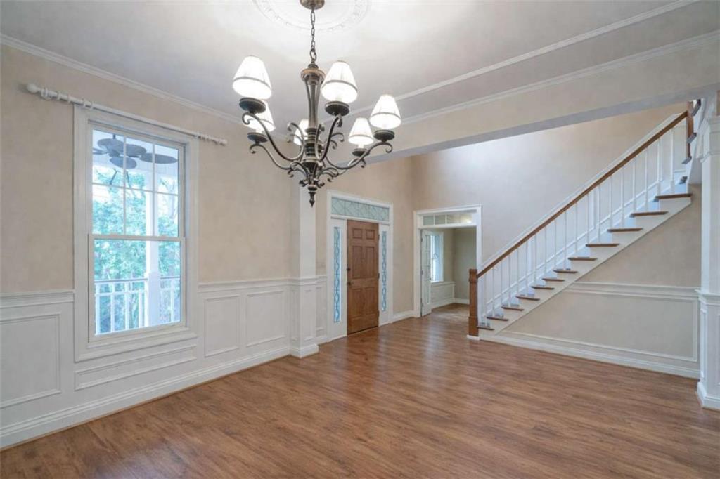 1660 A Maple Ridge Drive Loganville, GA 30052 - Photo 13 of 51 a view of a livingroom with wooden floor and staircase