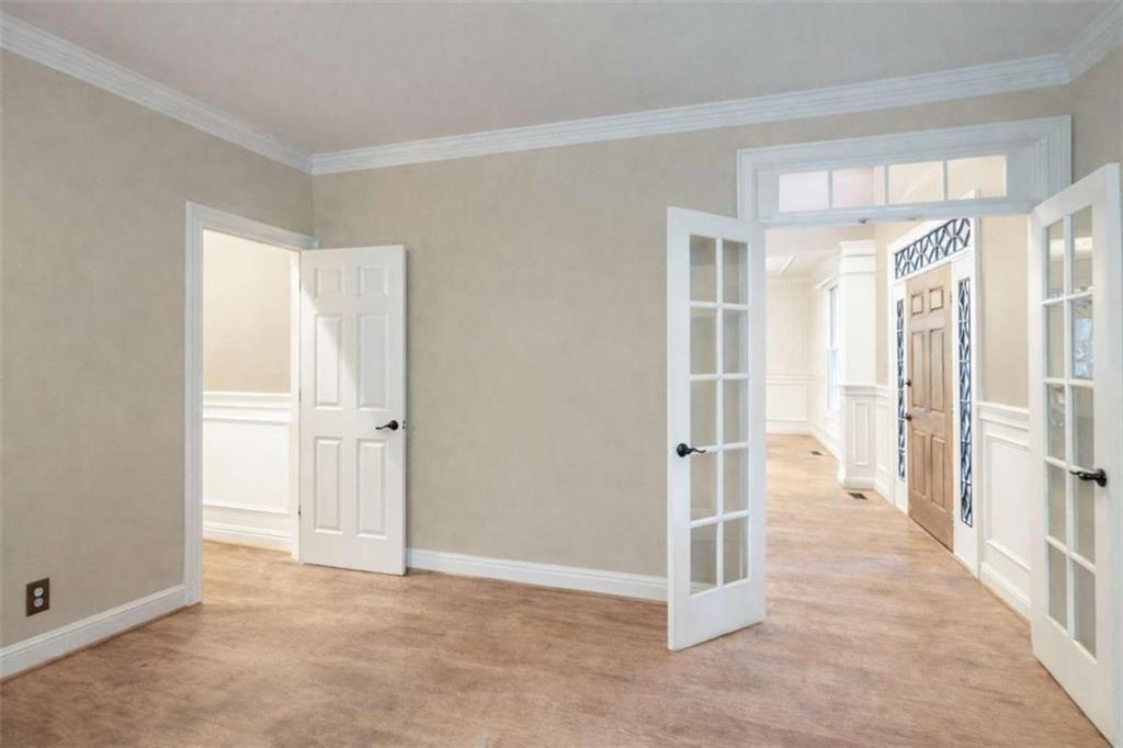 1660 A Maple Ridge Drive Loganville, GA 30052 - Photo 14 of 51 a view of a hallway with wooden shelves
