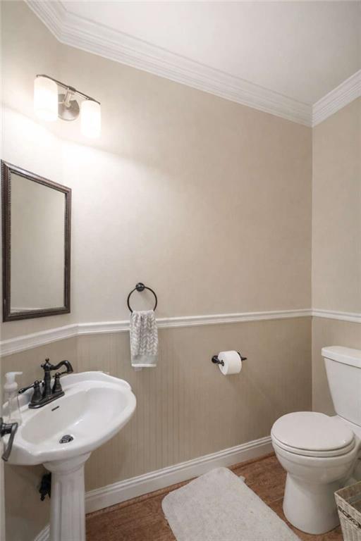 1660 A Maple Ridge Drive Loganville, GA 30052 - Photo 17 of 51 a bathroom with a sink a toilet and mirror