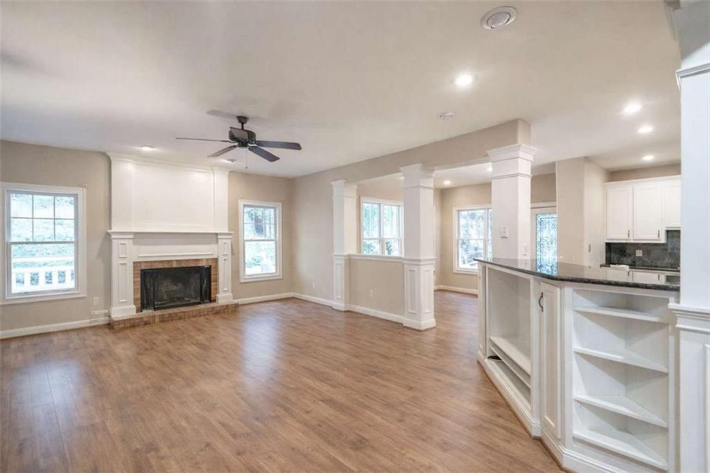 1660 A Maple Ridge Drive Loganville, GA 30052 - Photo 18 of 51 a view of an empty room with a fireplace and a window