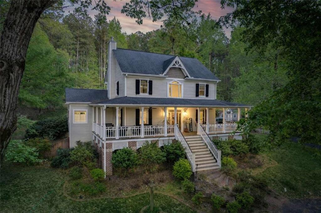 1660 A Maple Ridge Drive Loganville, GA 30052 - Photo 2 of 51 a front view of a house with a yard