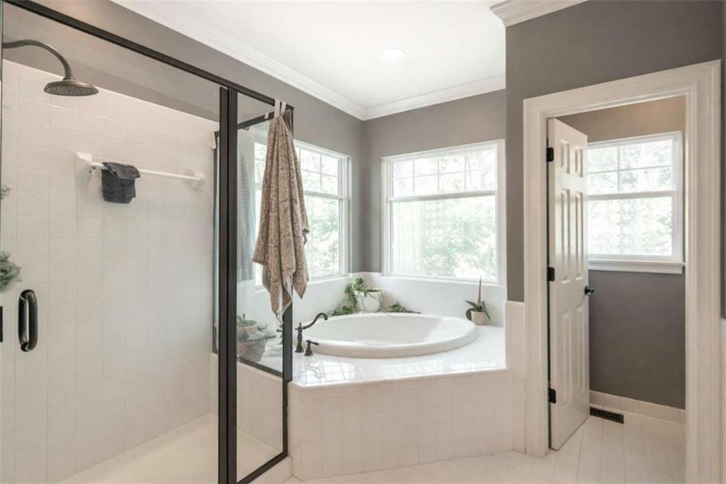 1660 A Maple Ridge Drive Loganville, GA 30052 - Photo 29 of 51 a bathroom with a tub and a sink