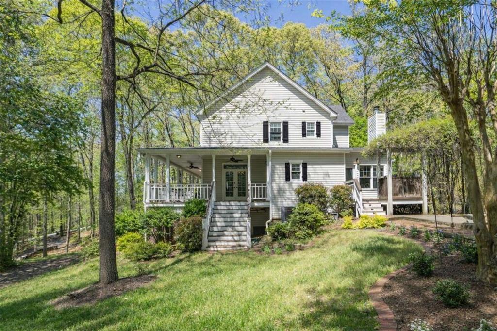 1660 A Maple Ridge Drive Loganville, GA 30052 - Photo 50 of 51 a view of a house with yard and sitting area