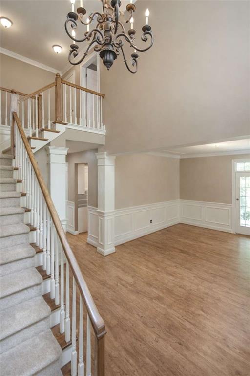 1660 A Maple Ridge Drive Loganville, GA 30052 - Photo 10 of 51 a view of a hallway with chandelier