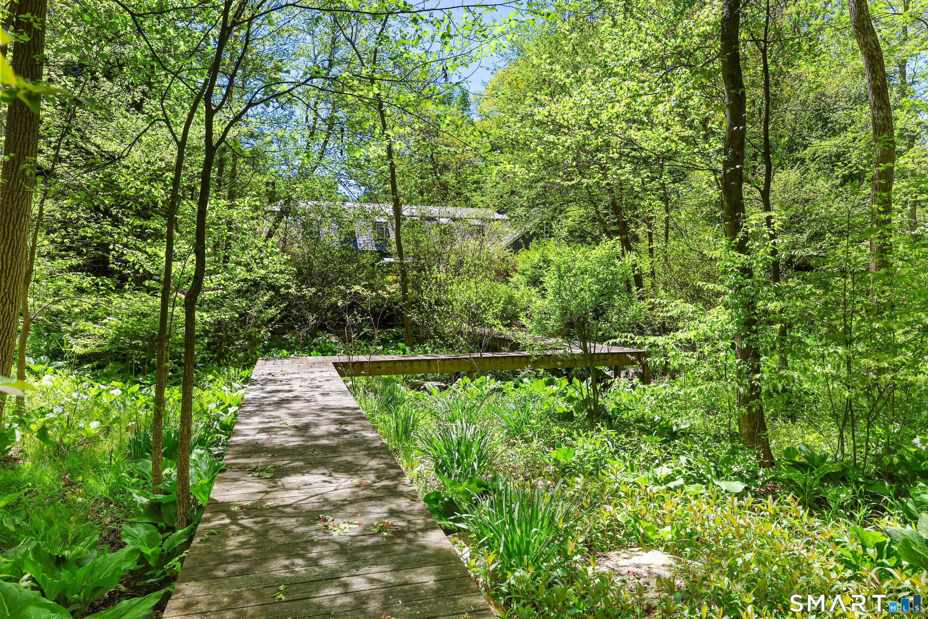4 Old Barlow Mountain Road Ridgefield, CT 06877 - Photo 14 of 40 a view of a pathway of a garden
