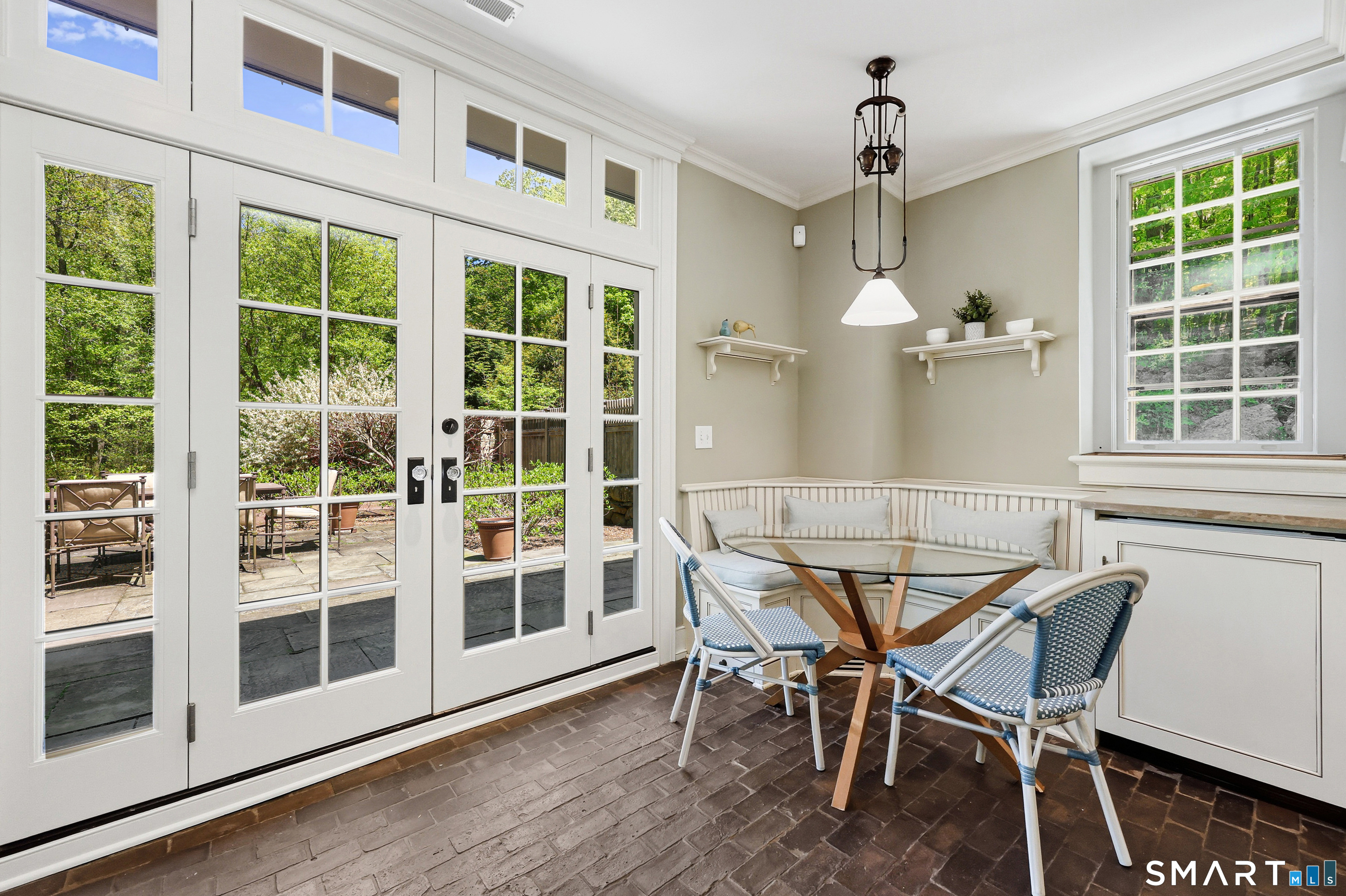 4 Old Barlow Mountain Road Ridgefield, CT 06877 - Photo 17 of 40 a dining room with furniture large windows and wooden floor