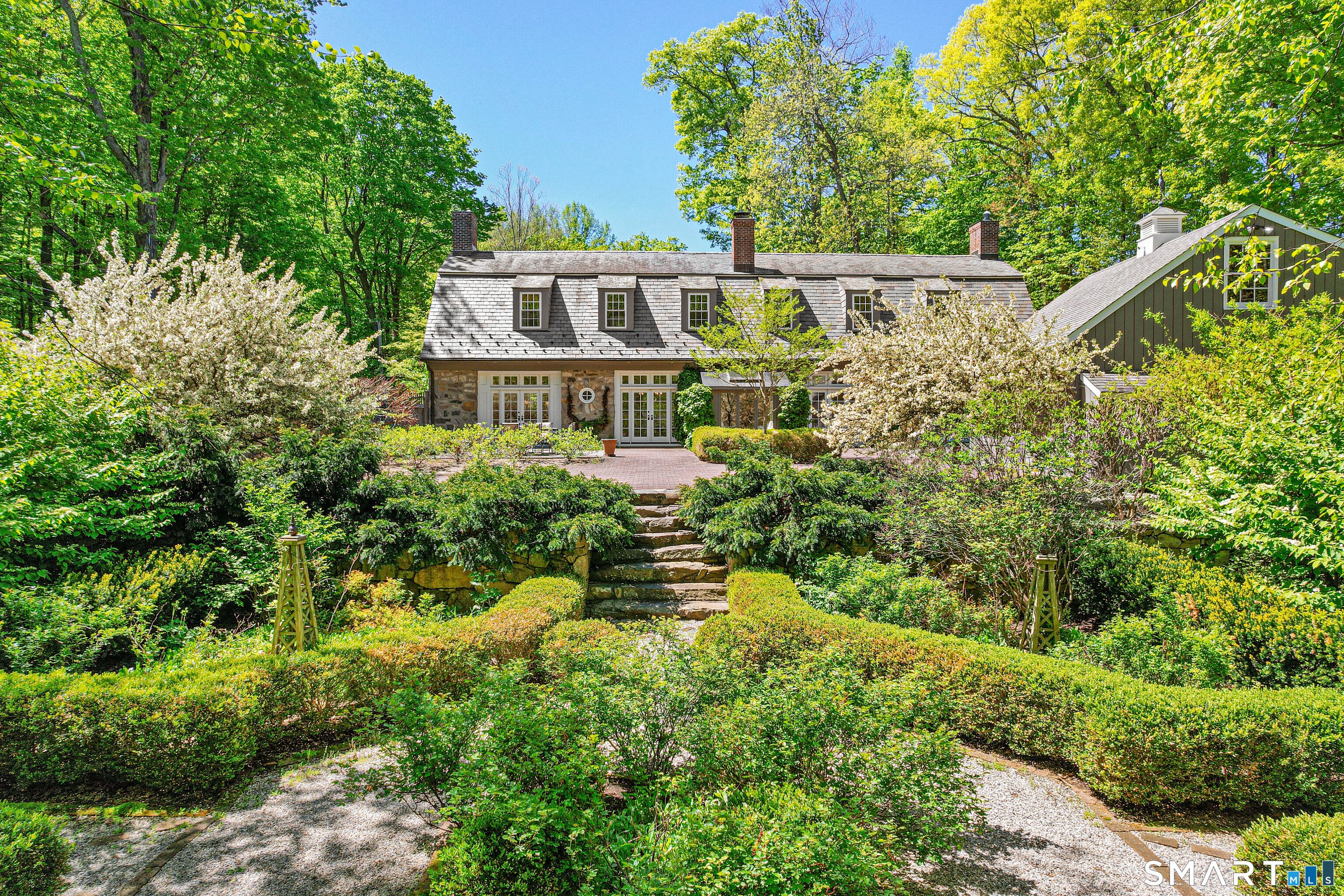 4 Old Barlow Mountain Road Ridgefield, CT 06877 - Photo 2 of 40 a view of a house with a yard and plants