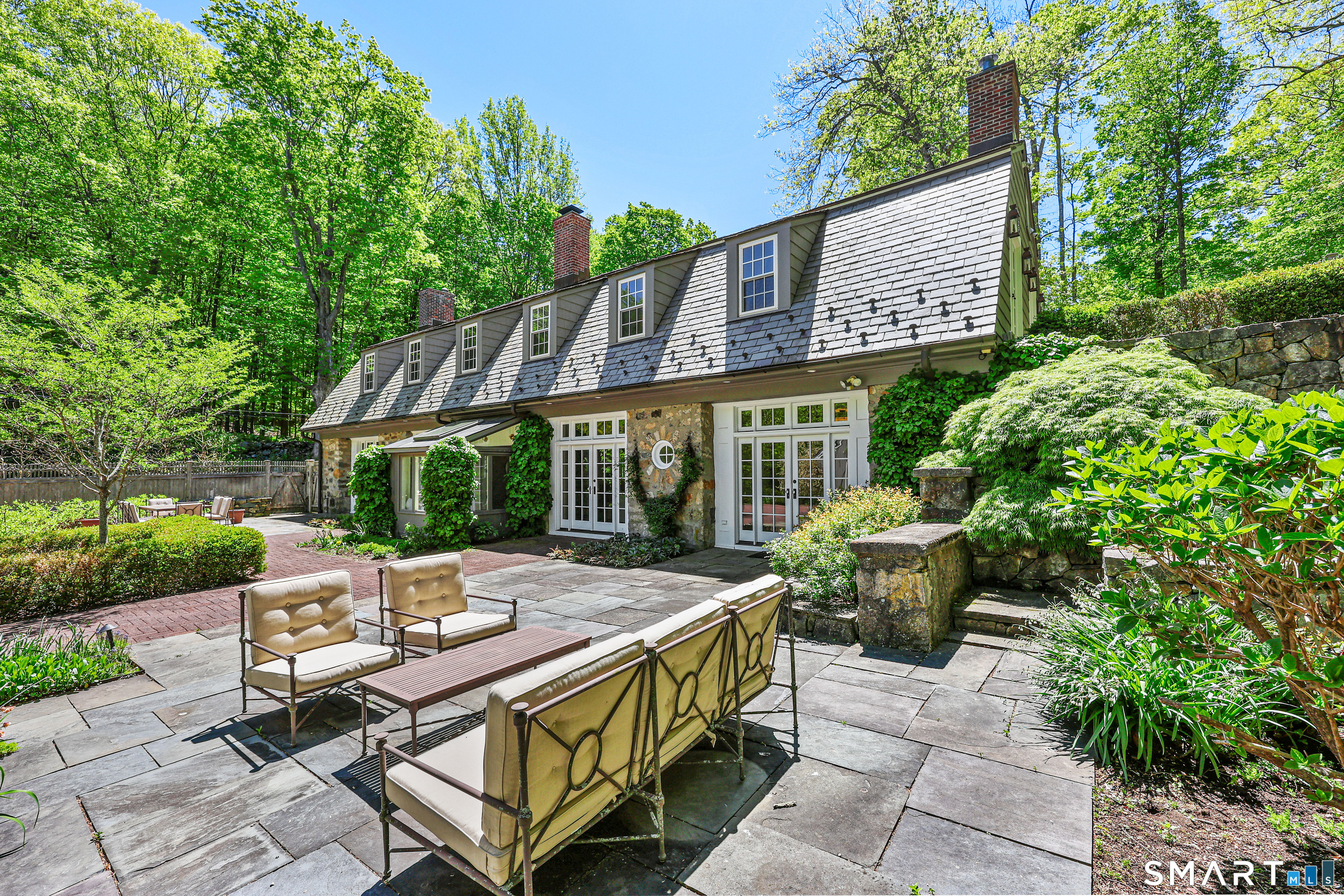 4 Old Barlow Mountain Road Ridgefield, CT 06877 - Photo 36 of 40 a view of house with outdoor seating and green space
