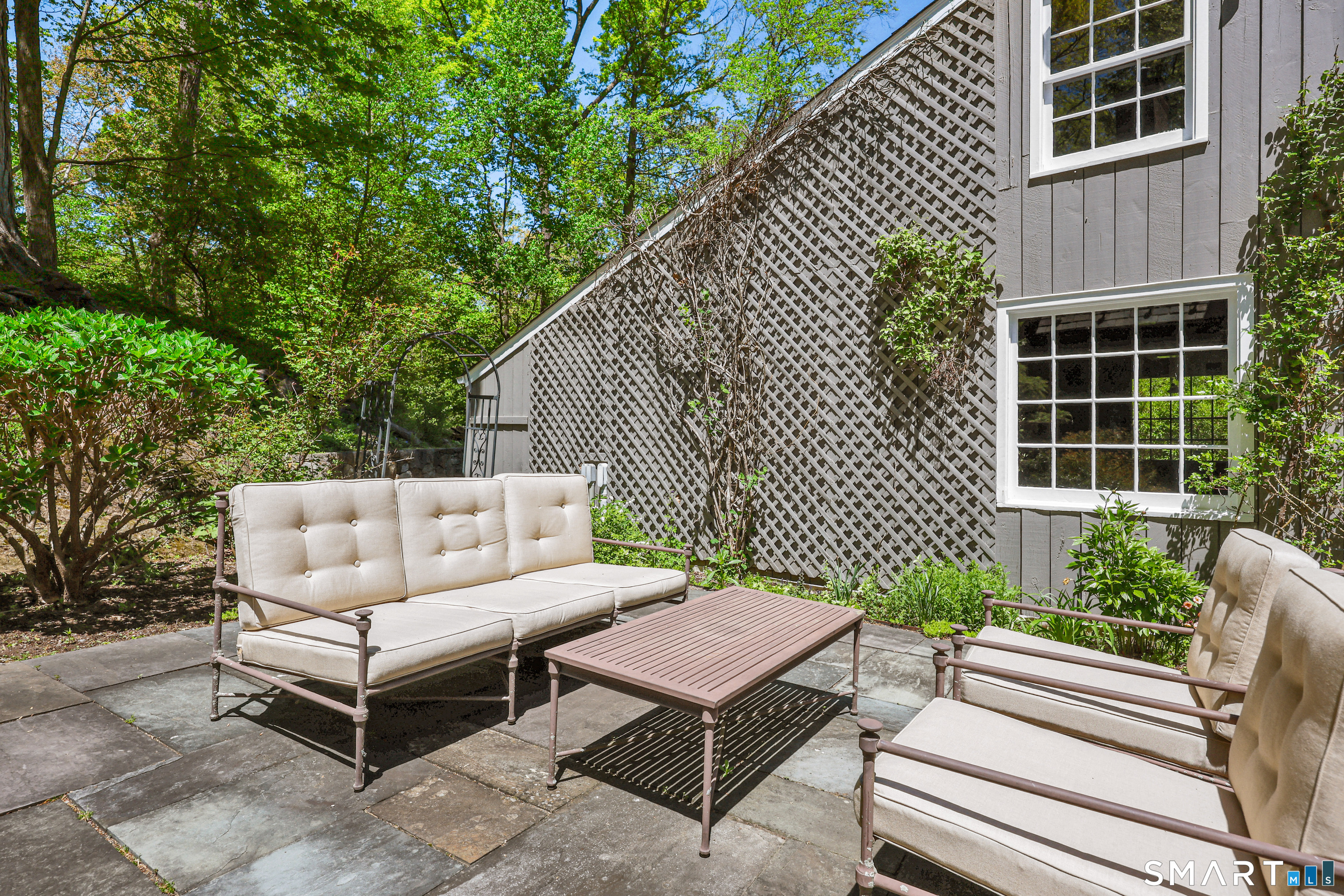 4 Old Barlow Mountain Road Ridgefield, CT 06877 - Photo 37 of 40 a house view with a sitting space and garden
