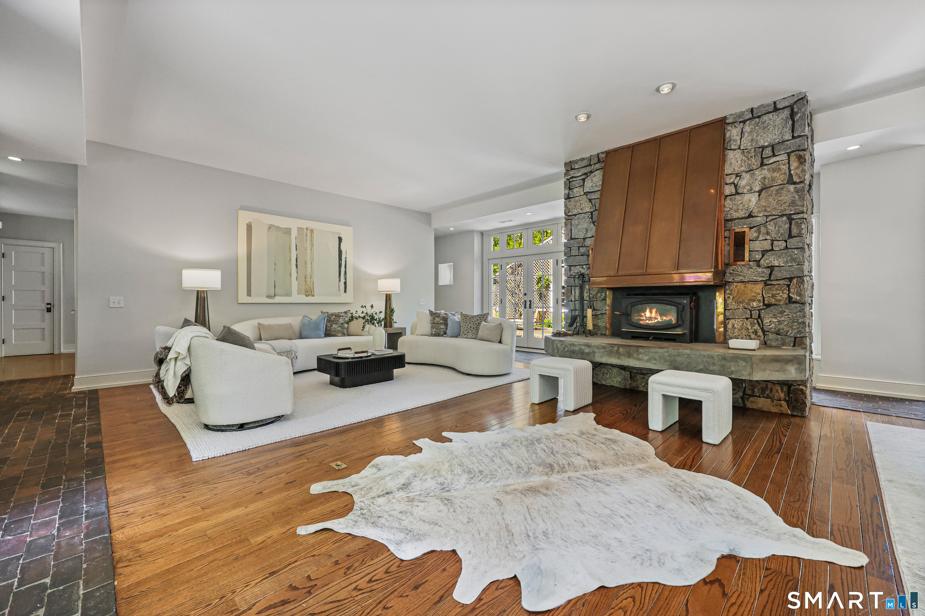 4 Old Barlow Mountain Road Ridgefield, CT 06877 - Photo 6 of 40 a living room with furniture and a fireplace