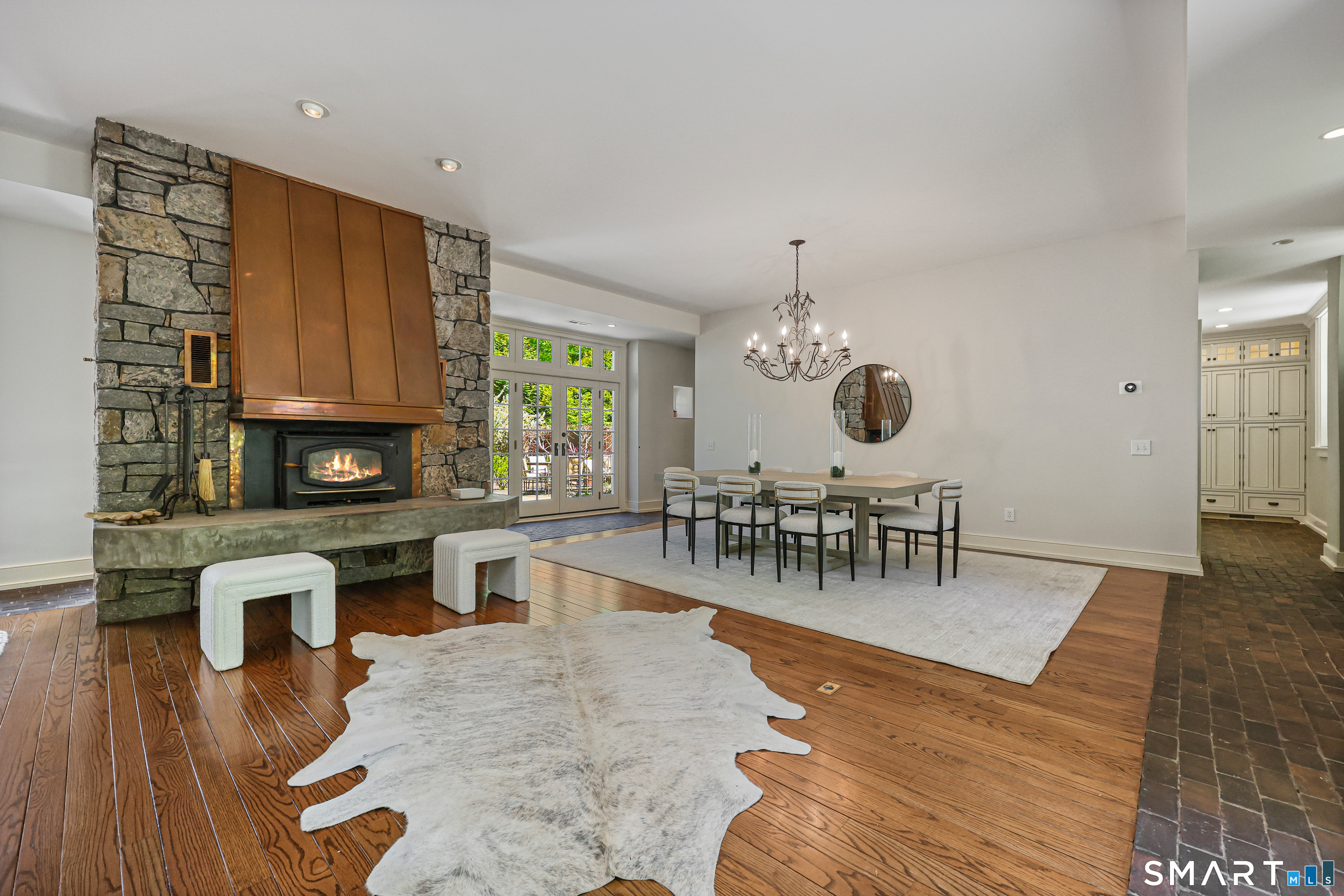 4 Old Barlow Mountain Road Ridgefield, CT 06877 - Photo 8 of 40 a view of a dining room with furniture window and wooden floor