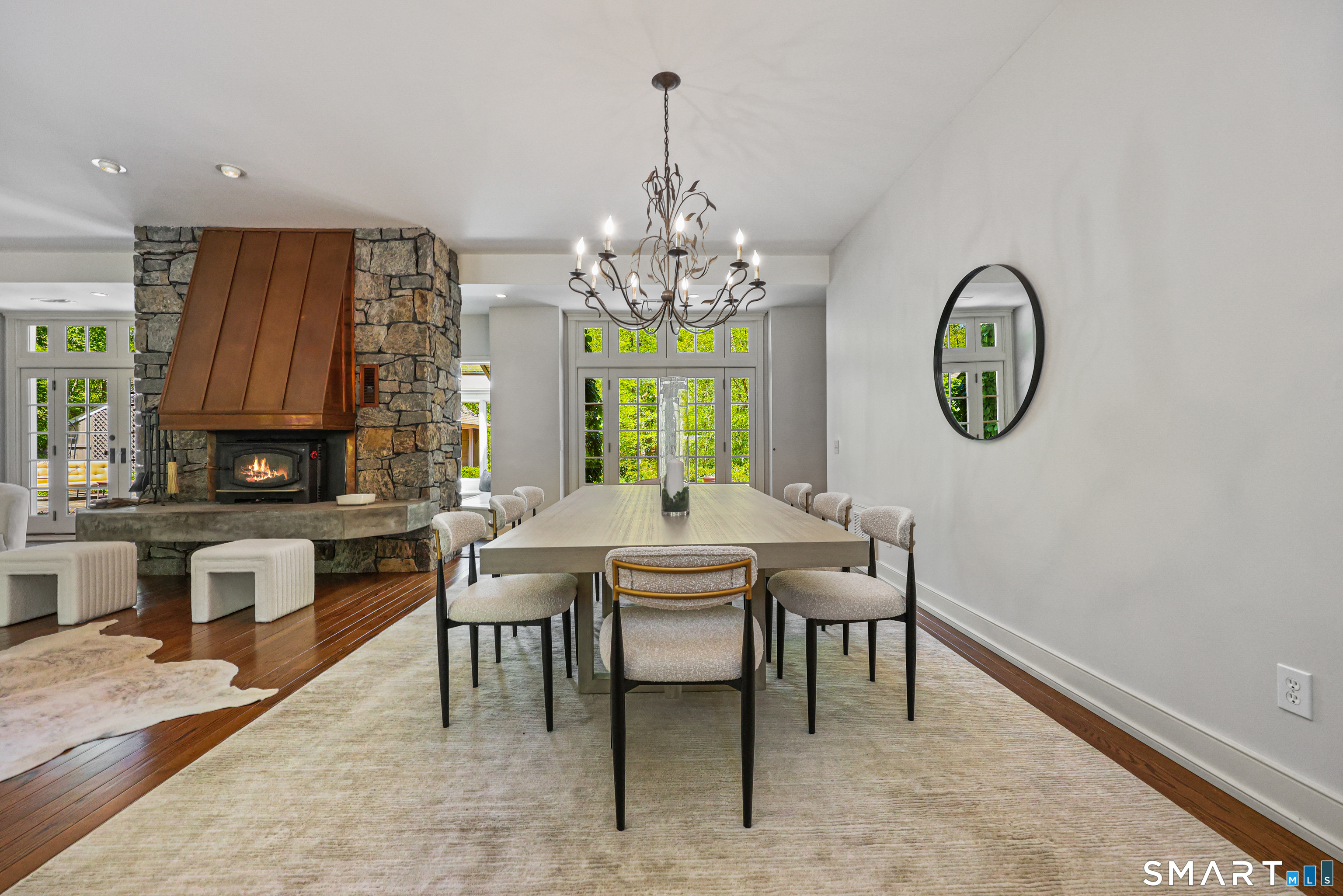 4 Old Barlow Mountain Road Ridgefield, CT 06877 - Photo 10 of 40 a dining room with chandelier fan and wooden floor