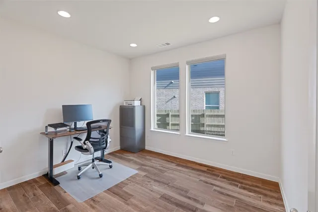 a workspace with furniture and a window