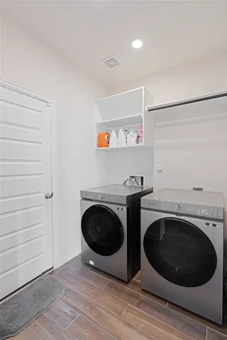 a view of a storage & utility room with washer and dryer
