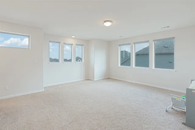 a view of empty room with windows