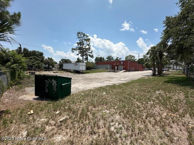 205 South Wickham Road Melbourne, FL 32904 - Photo 10 of 10 a view of a outdoor space with trees