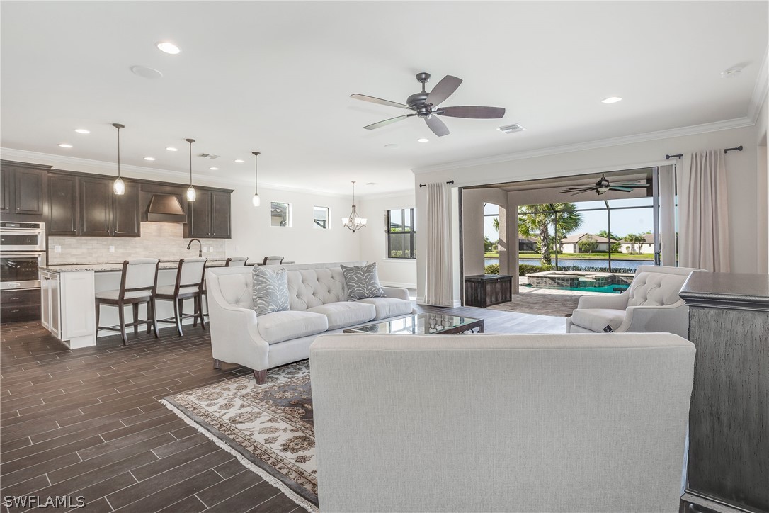 10828 Rutherford Road Fort Myers, FL 33913 - Photo 11 of 31 a living room with furniture and a large window