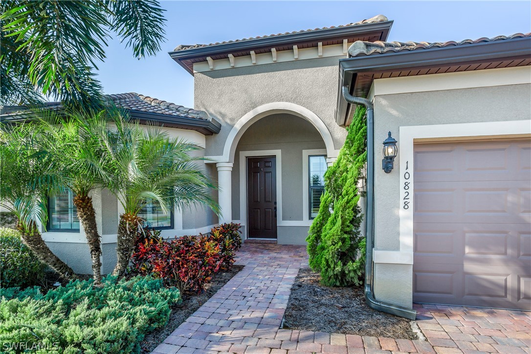 10828 Rutherford Road Fort Myers, FL 33913 - Photo 2 of 31 a view of a house with potted plants