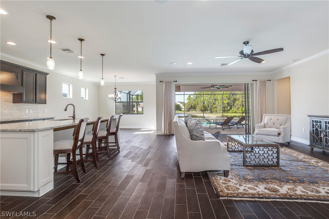 10828 Rutherford Road Fort Myers, FL 33913 - Photo 3 of 31 a living room with furniture and a large window