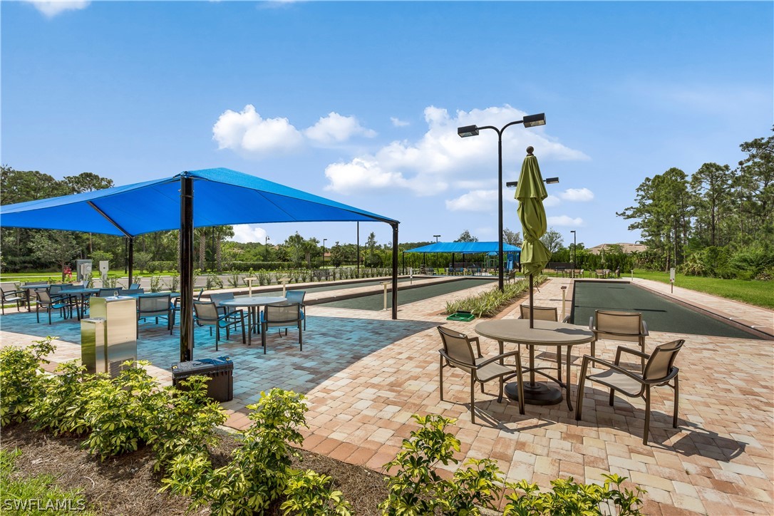 10828 Rutherford Road Fort Myers, FL 33913 - Photo 31 of 31 a view of chairs and tables in the patio