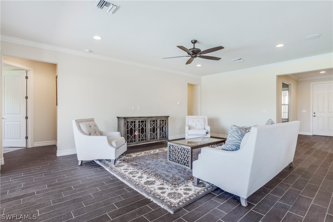 10828 Rutherford Road Fort Myers, FL 33913 - Photo 9 of 31 a living room with furniture and a rug