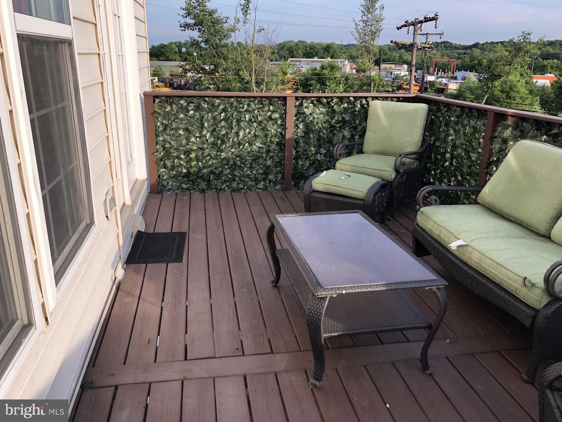 17696 Possum Point Road Dumfries, VA 22026 - Photo 21 of 45 a balcony with wooden floor