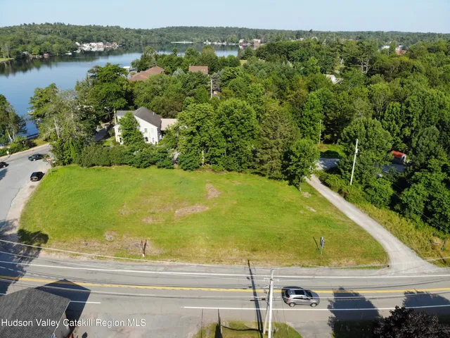 an aerial view of a house with lake view