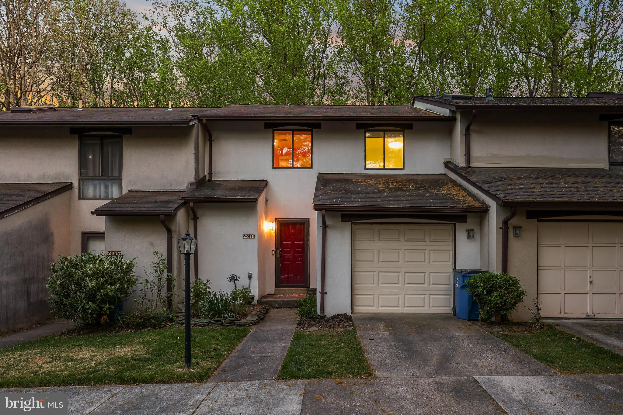 2319 Glade Bank Way Reston, VA 20191 - Photo 1 of 1 a front view of a house with garden