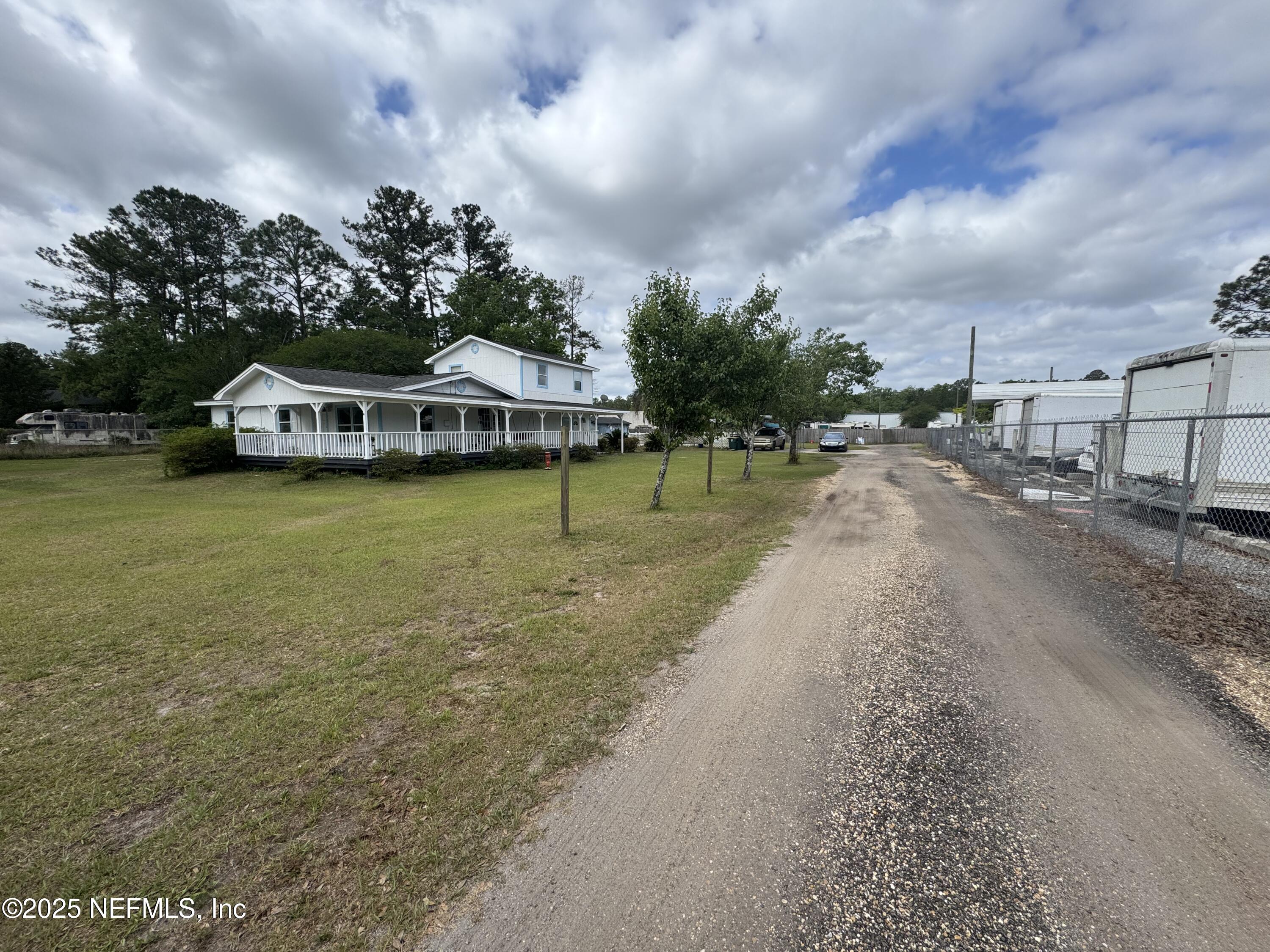 5515-5517 Shad Road Jacksonville, FL 32257 - Photo 17 of 17 a front view of a house with garden
