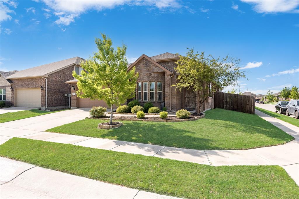 Front of the property on a gorgeous corner lot.