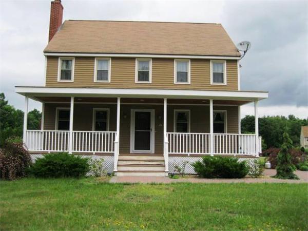 401 Mulpus Road Lunenburg, MA 01462 - Photo 1 of 15 a front view of a house with a garden