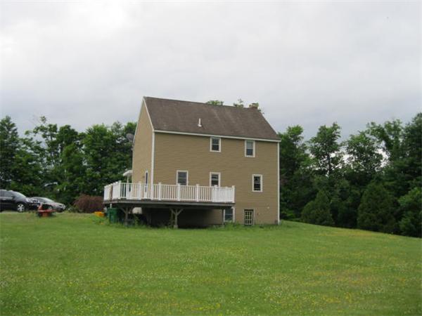 401 Mulpus Road Lunenburg, MA 01462 - Photo 11 of 15 a front view of a house with a garden and yard