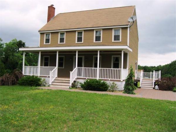 401 Mulpus Road Lunenburg, MA 01462 - Photo 12 of 15 a view of a house with a yard and plants