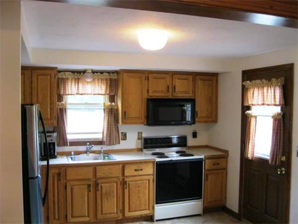 401 Mulpus Road Lunenburg, MA 01462 - Photo 7 of 15 a kitchen with stainless steel appliances granite countertop a stove a sink and a refrigerator
