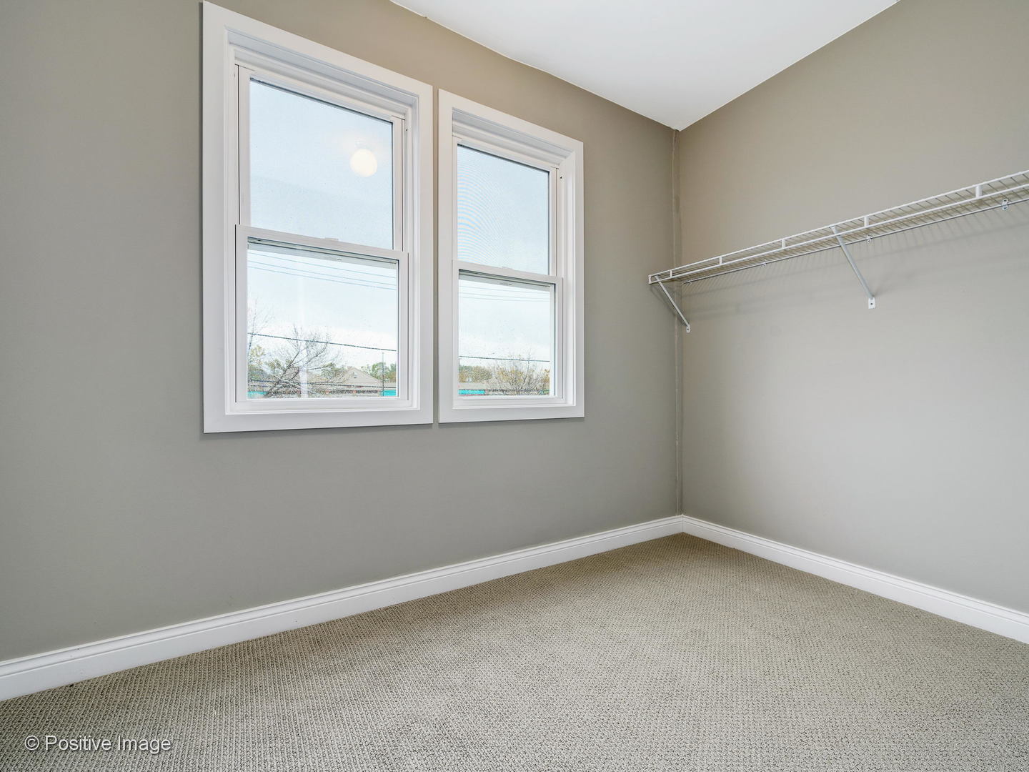 2919 North Kilpatrick Avenue, Unit 2 Chicago, IL 60641 - Photo 14 of 17 an empty room with a window