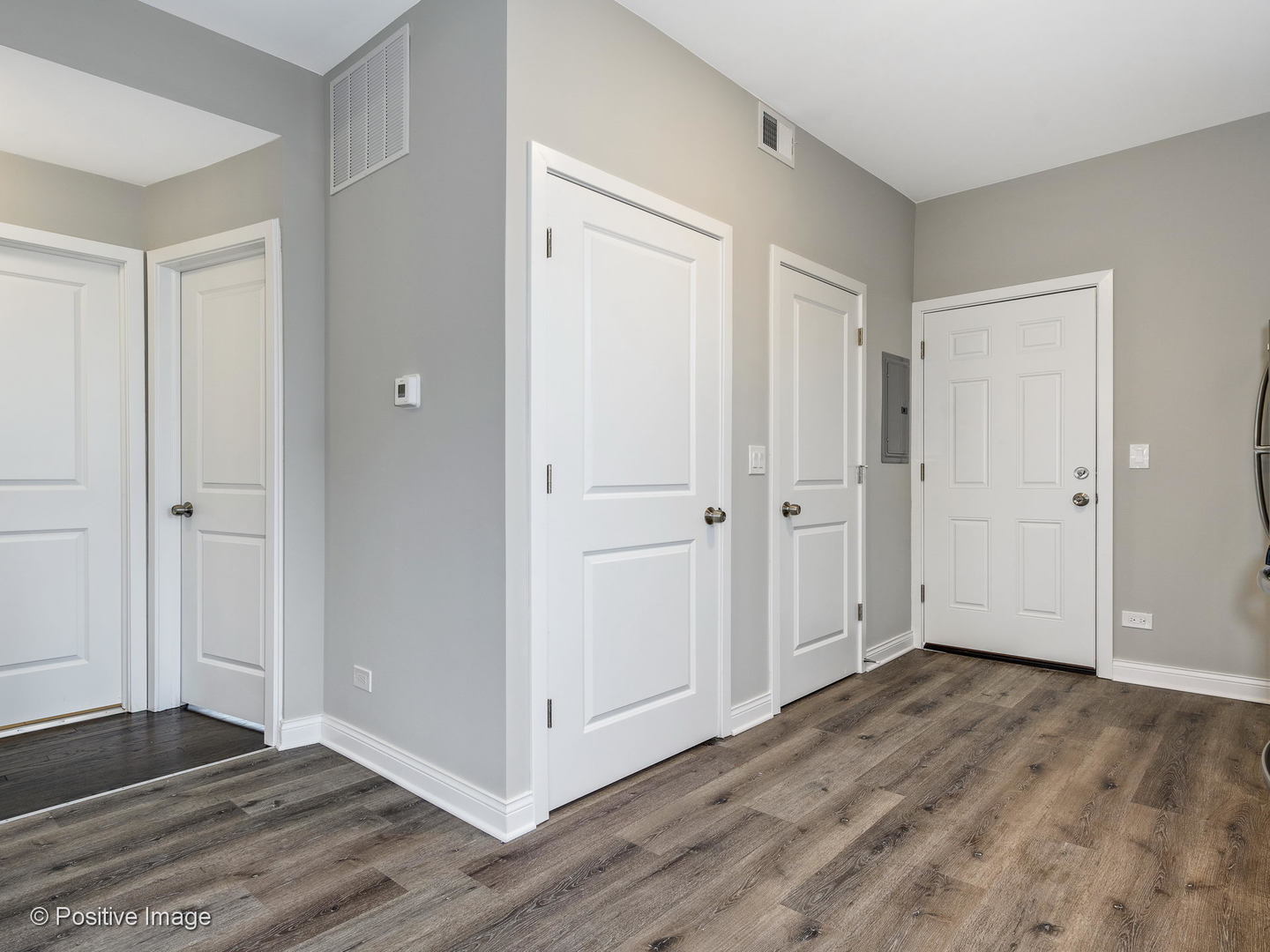 2919 North Kilpatrick Avenue, Unit 2 Chicago, IL 60641 - Photo 10 of 17 a view of an empty room with wooden floor