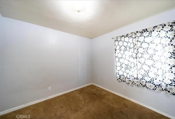 en empty room with windows