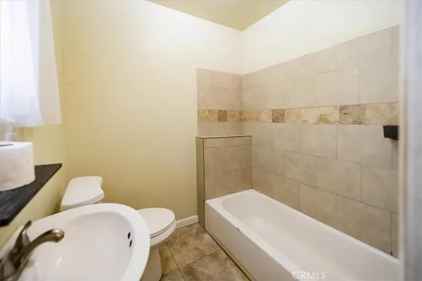 a bathroom with a sink and bathtub