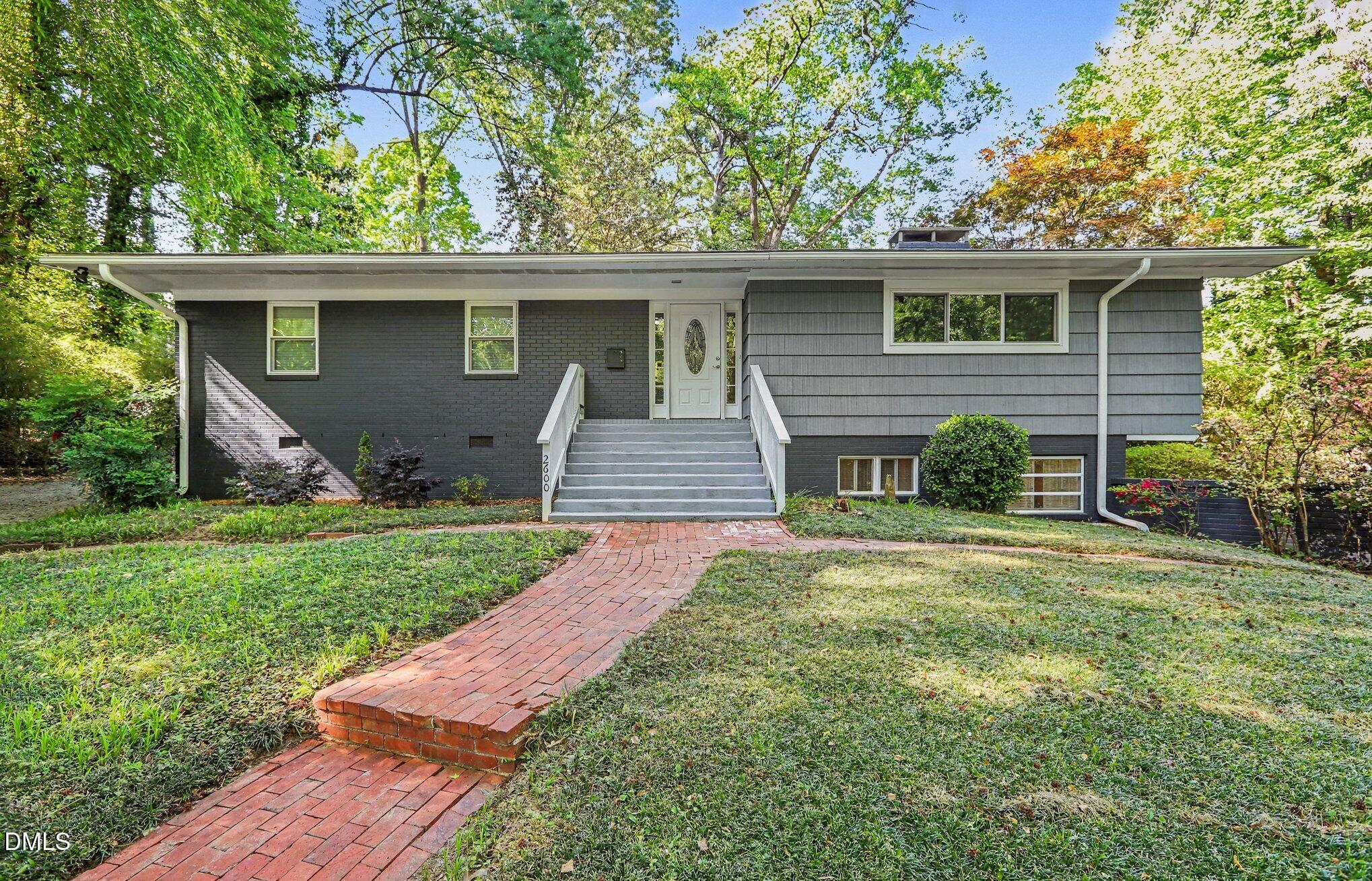 2600 Wade Avenue Raleigh, NC 27607 - Photo 1 of 31 front view of a house with a yard