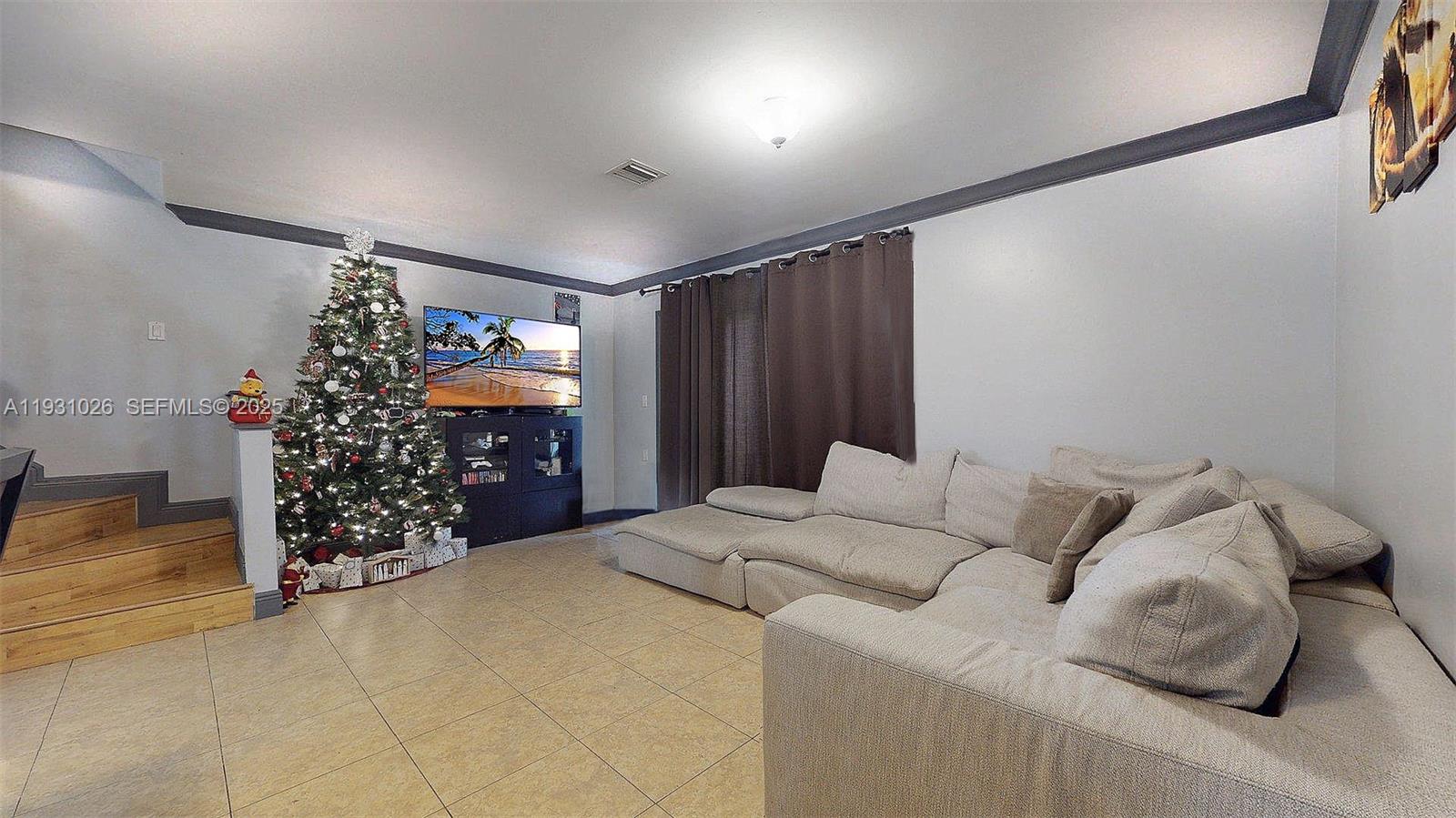 6279 Southwest 128th Court Miami, FL 33183 - Photo 14 of 32 a bed room with a bed and a couch