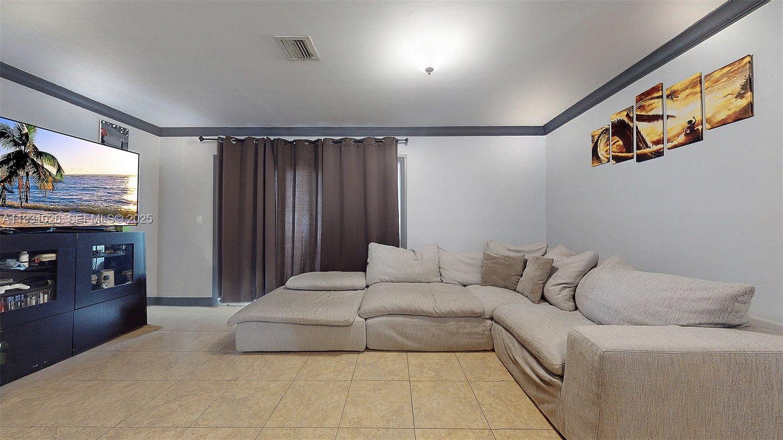 6279 Southwest 128th Court Miami, FL 33183 - Photo 16 of 32 a living room with furniture and a flat screen tv