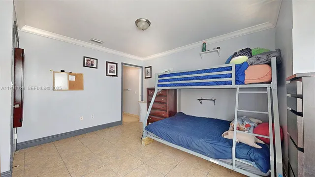 a bedroom with furniture and a cabinet