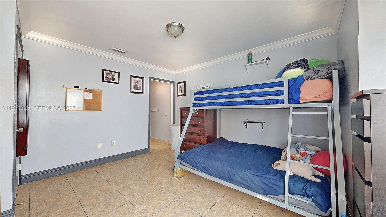 6279 Southwest 128th Court Miami, FL 33183 - Photo 18 of 32 a bedroom with bunk bed and a window