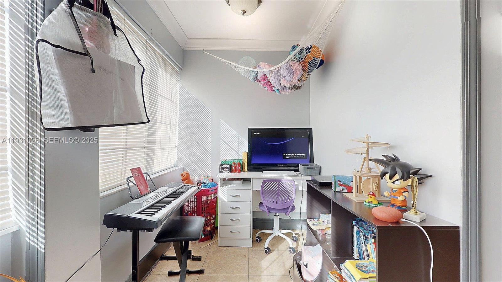 6279 Southwest 128th Court Miami, FL 33183 - Photo 20 of 32 a room with furniture and a flat screen tv