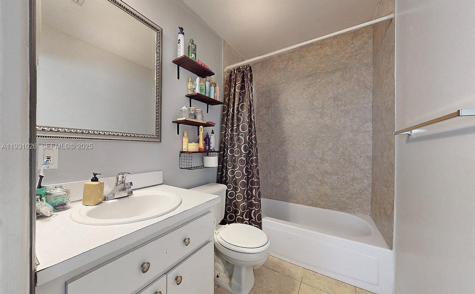 6279 Southwest 128th Court Miami, FL 33183 - Photo 21 of 32 a bathroom with a sink a toilet and shower