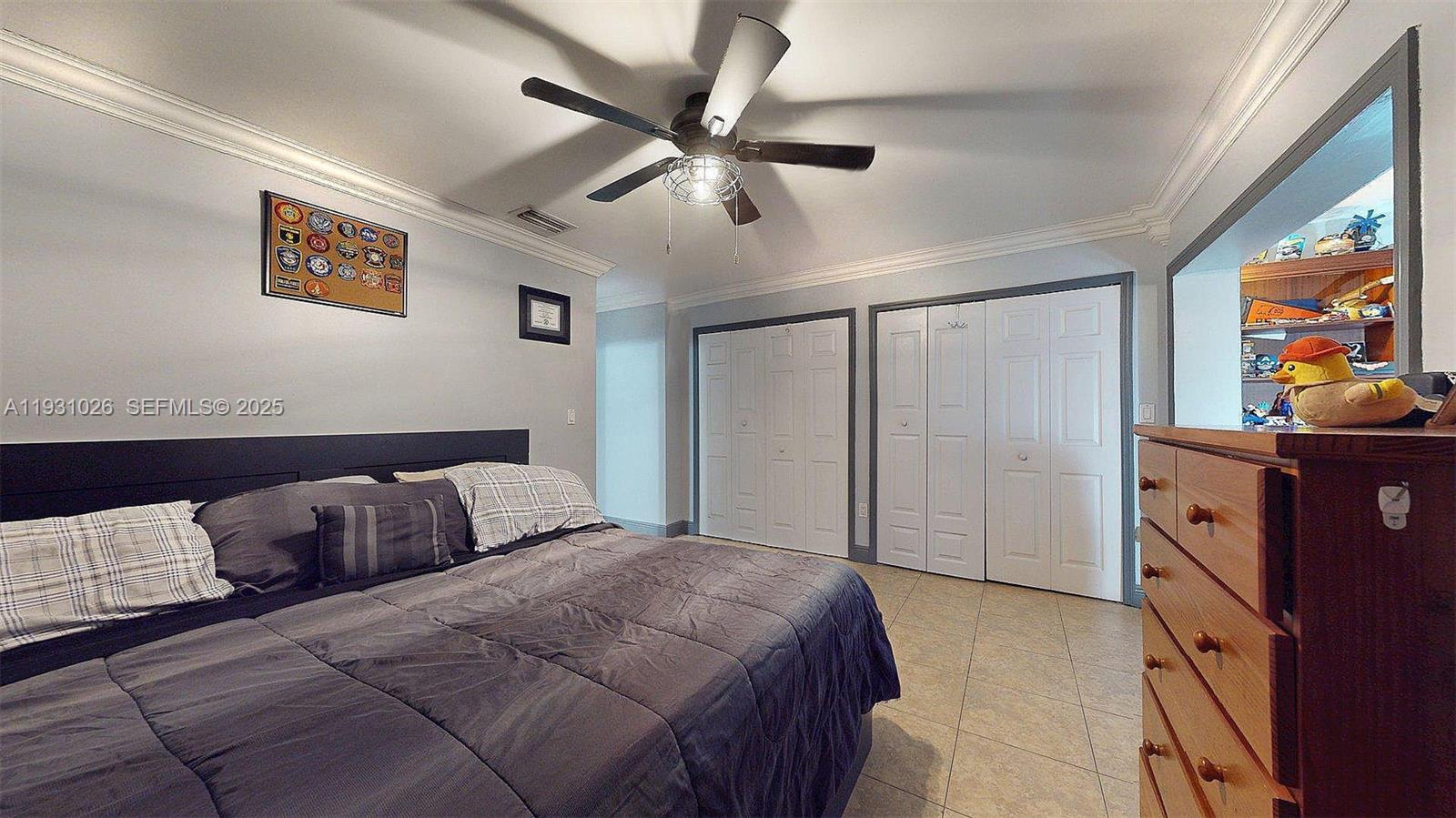 6279 Southwest 128th Court Miami, FL 33183 - Photo 22 of 32 a bedroom with a bed and wooden floor
