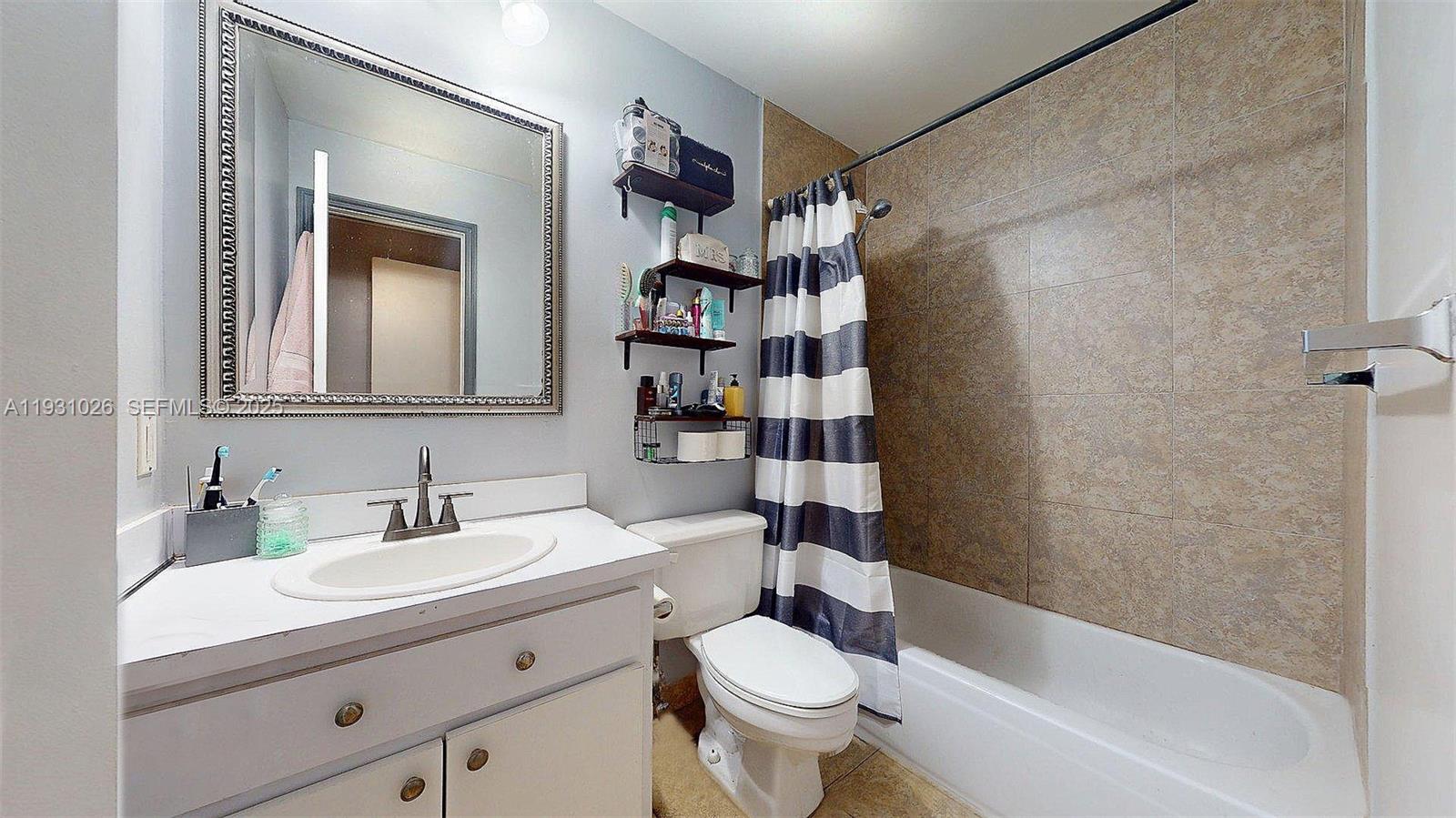 6279 Southwest 128th Court Miami, FL 33183 - Photo 26 of 32 a bathroom with a sink toilet and shower