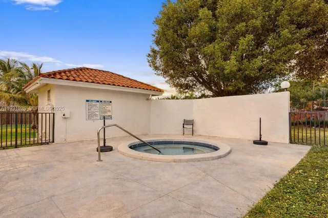 a view of a swimming pool with a patio